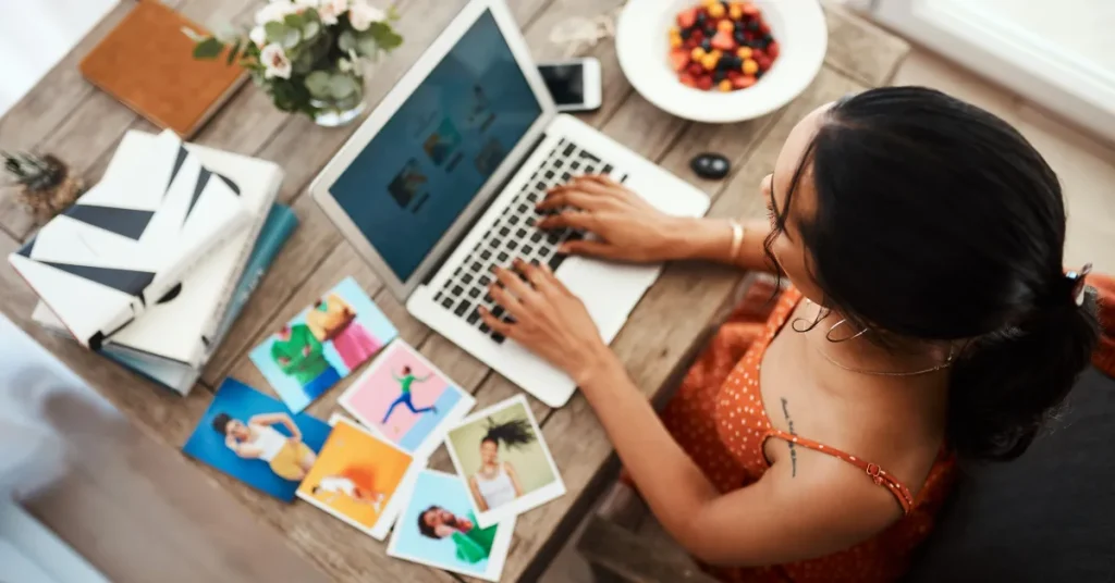 Photo of woman on laptop and full desk for the title image of "6 affiliate posts you need to use."