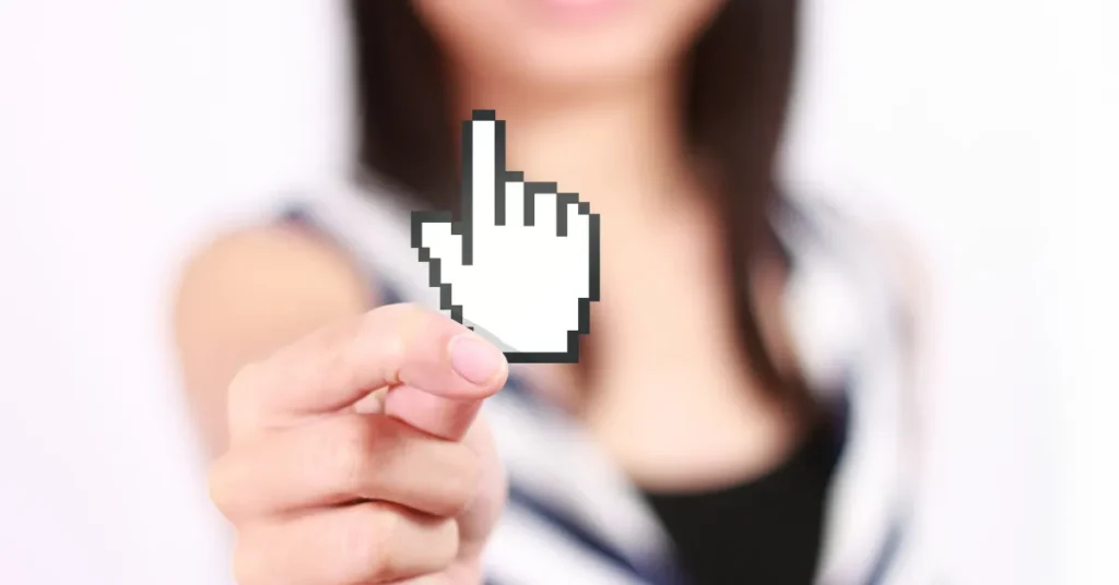 Photo of woman holding a click icon up to the center of the photo.